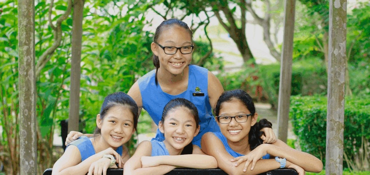 SCGS pupils wearing the school's familiar sleeveless blue dresses